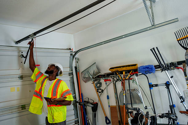 Professional Garage Door Panel Replacement technician working in Grill, PA
